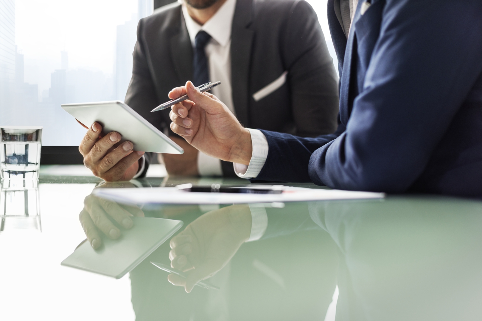 Business advisers reviewing a document.